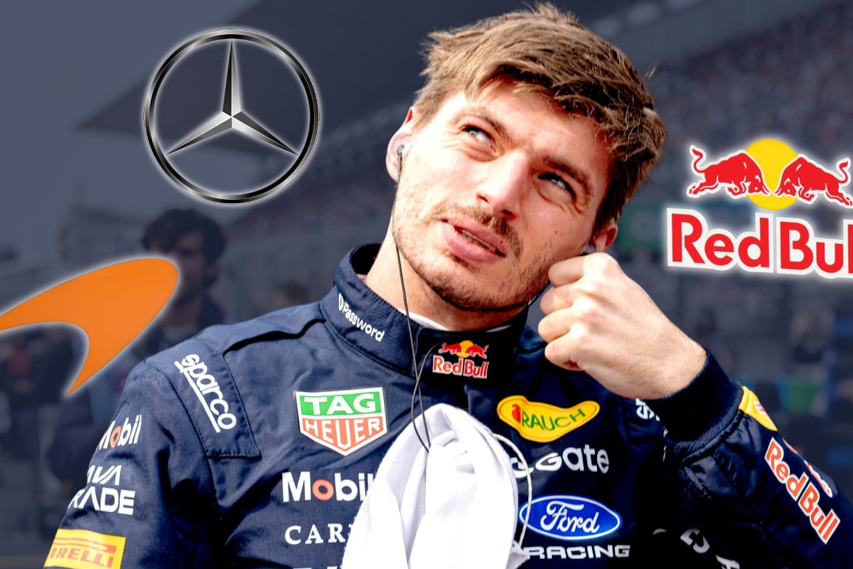 Max Verstappen looks up surrounded by Mercedes, McLaren and Red Bull logos