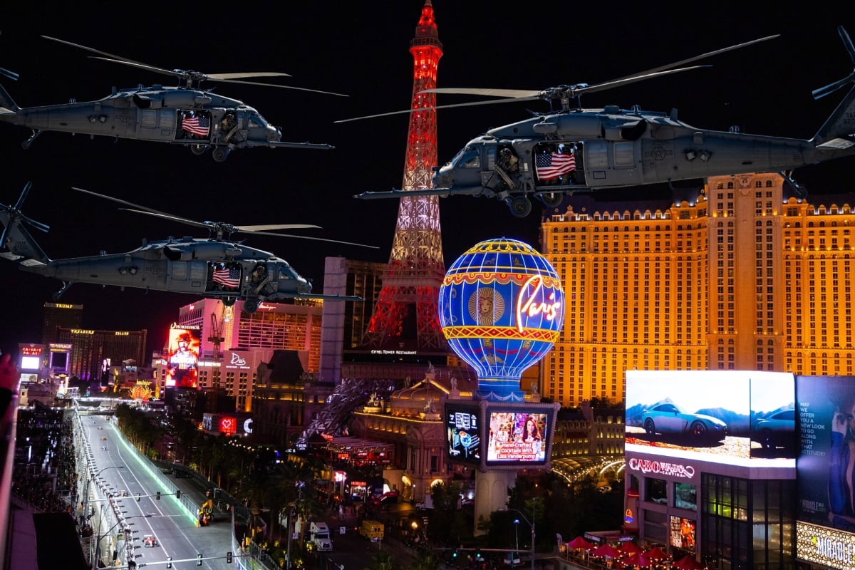Three helicopters fly over the Las Vegas Strip during the grand prix weekend