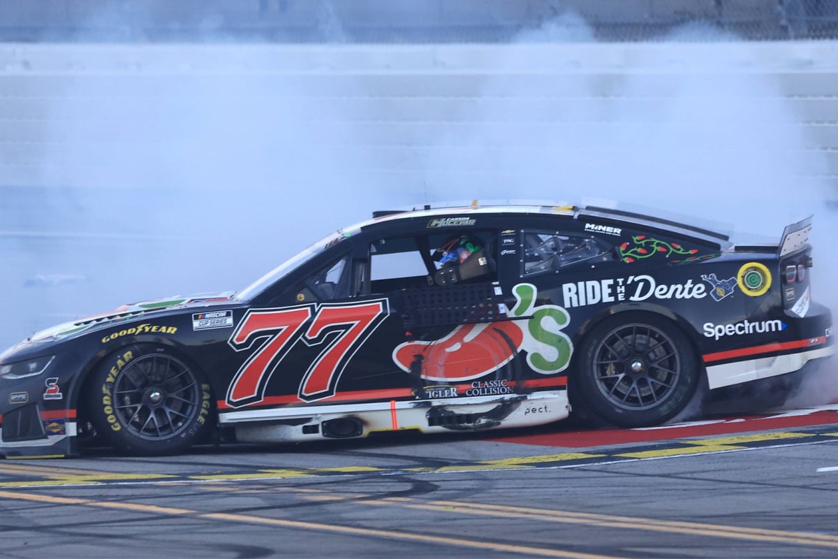An image of NASCAR star Carson Hocevar doing a celebratory burnout after his first Cup Series win at Talladega Superspeedway