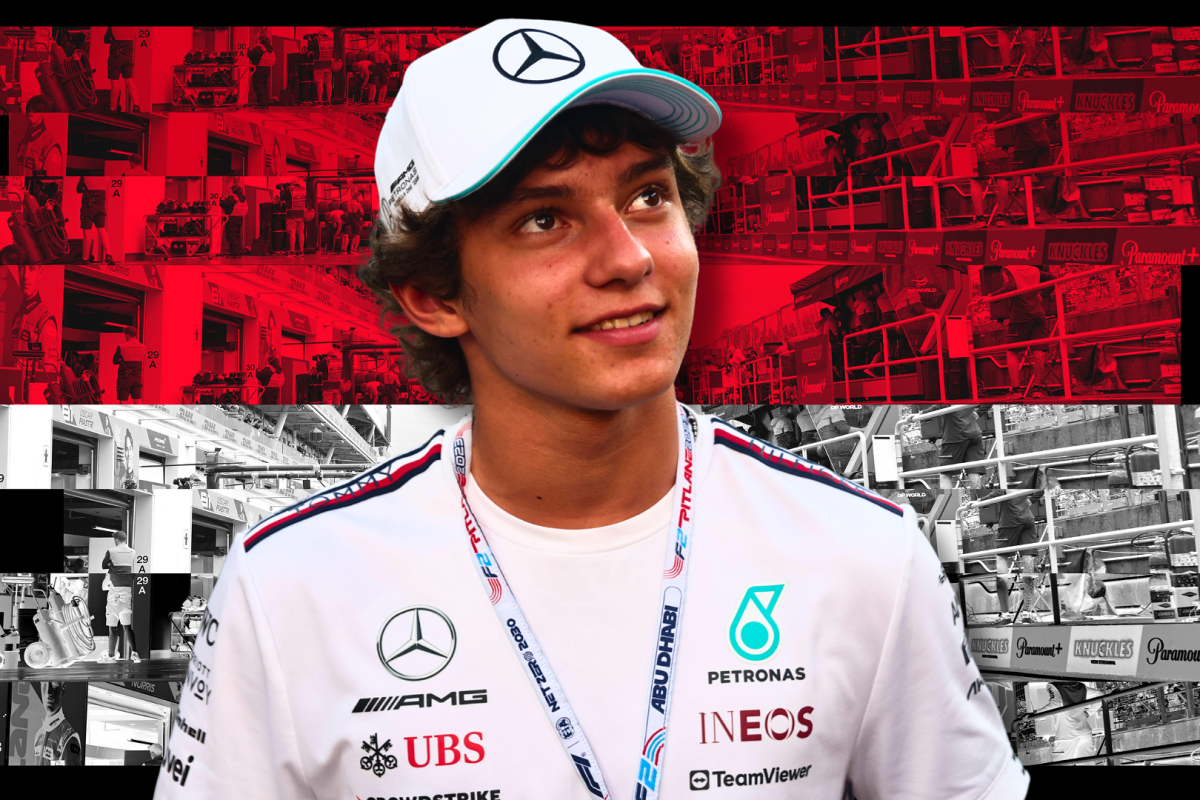 Antonelli smiling in white Mercedes tee and cap with red and white Monaco flag background