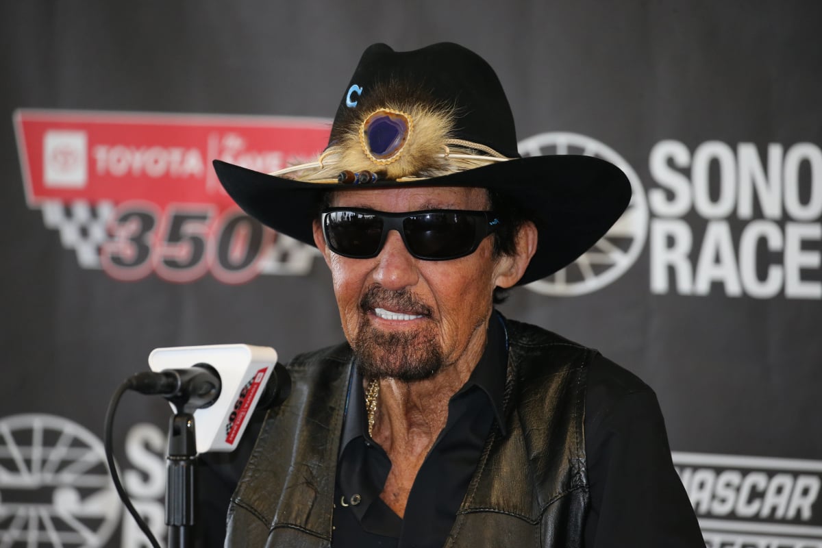 An image of NASCAR legend Richard Petty talking at a press conference