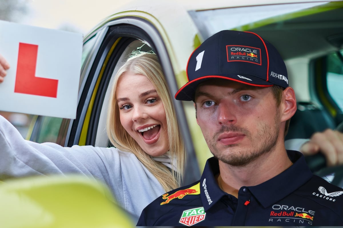 Max Verstappen is pictured in front of a car where a smiling girl holds up an L plate