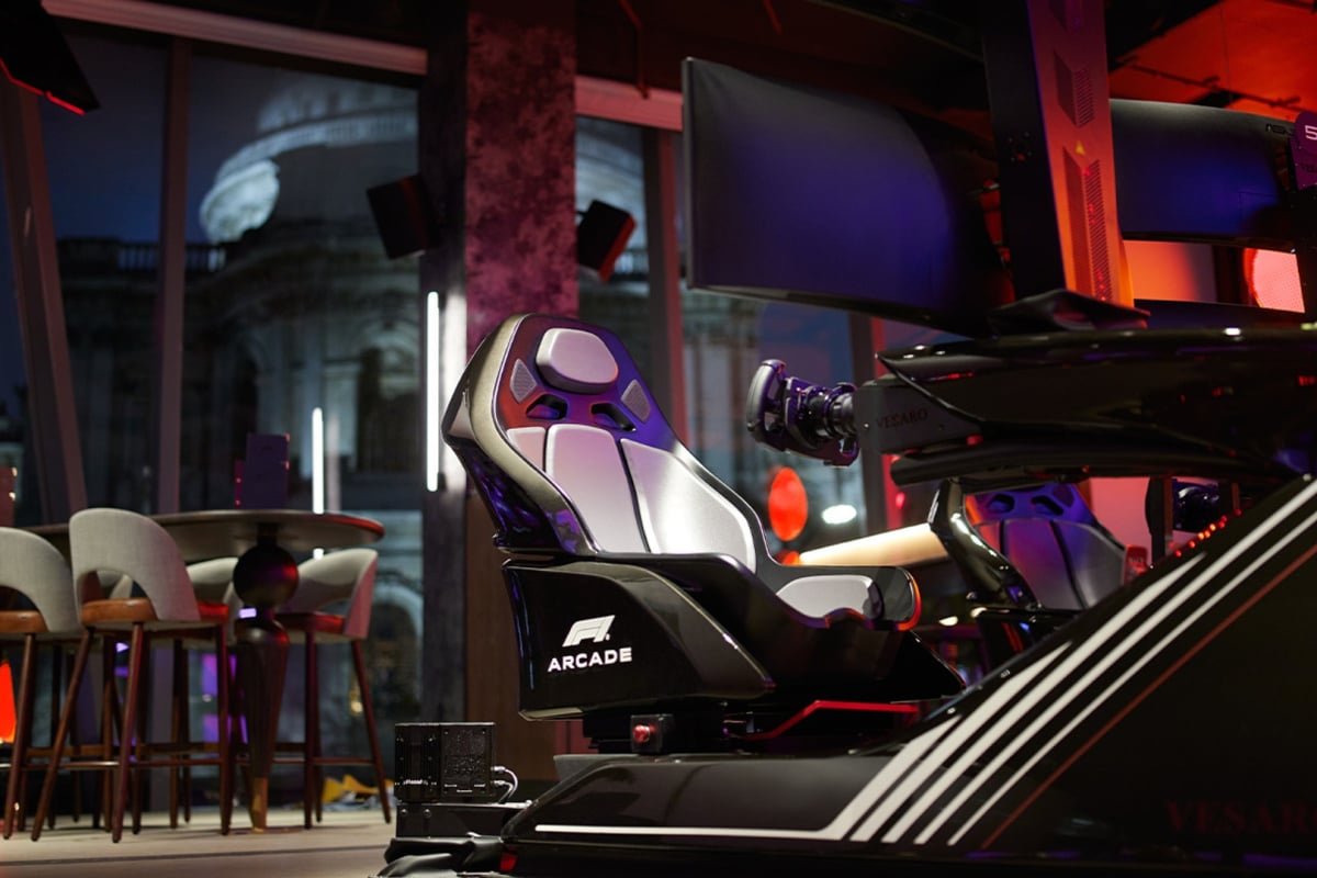 Image Credit: F1 Arcade. Affiliate image, do not use for other pieces please. F1 Arcade simulator with St Paul's Cathedral night view out the window