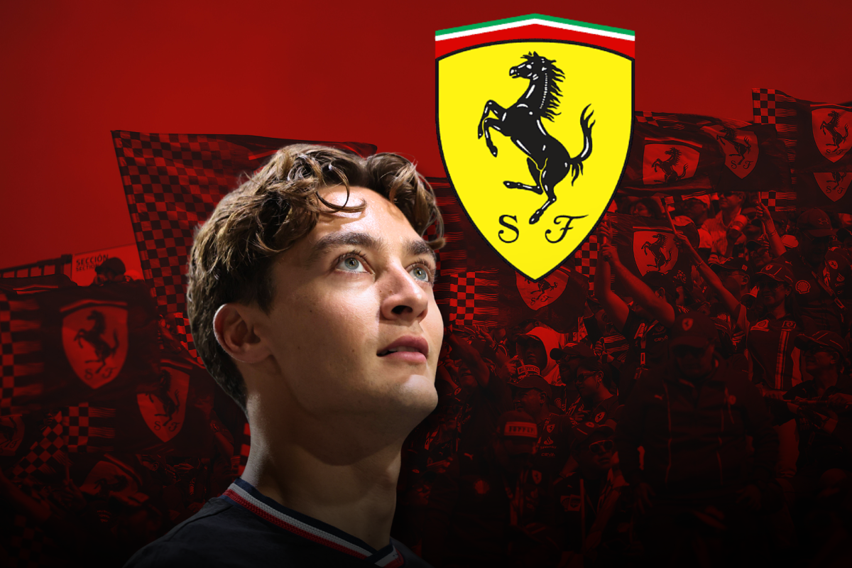 George Russell looks up at a Ferrari badge