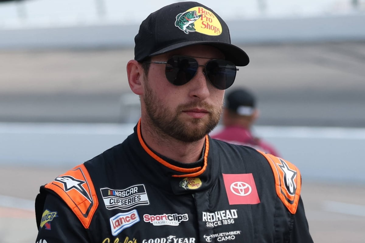 An image of NASCAR driver Chase Briscoe walking on pit road
