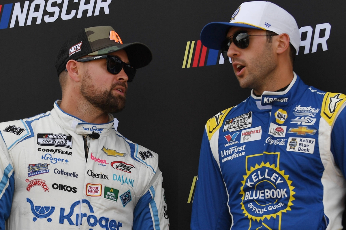 An image of NASCAR drivers Ricky Stenhouse Jr and Chase Elliott in discussion pre-race