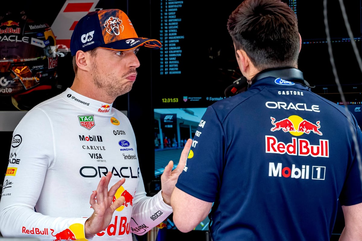Max Verstappen shrugs his shoulders and looks in dismay at the Red Bull Garage in Spa