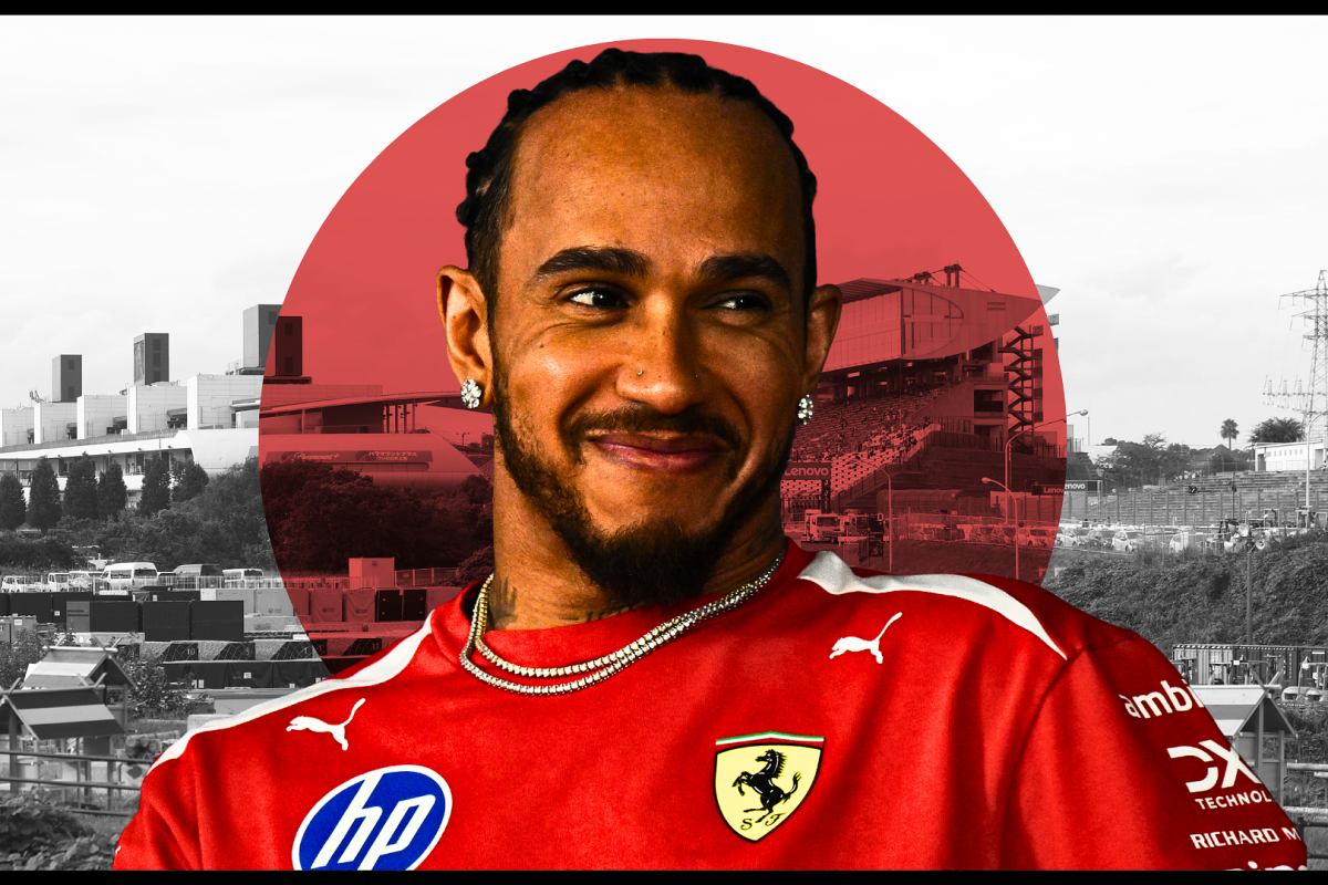 Lewis Hamilton looks on with the Japan flag in the background