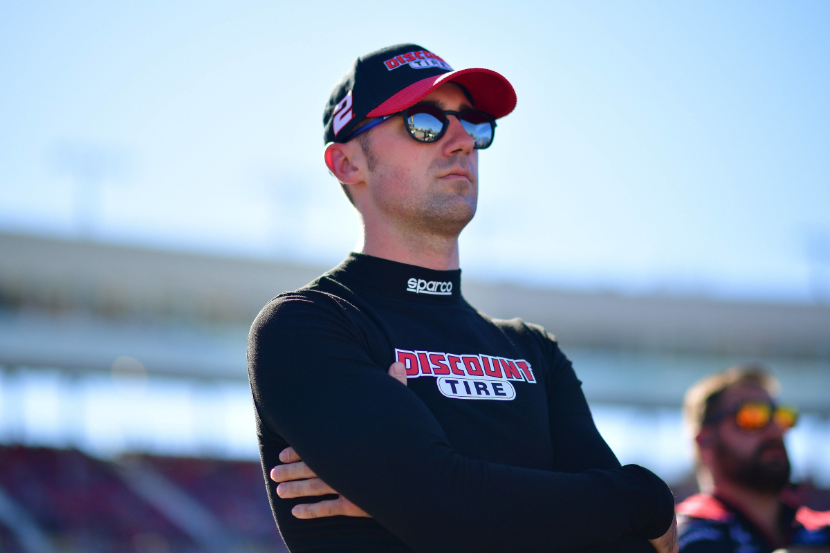 A generic image of NASCAR driver Austin Cindric with his arms crossed at Phoenix Raceway