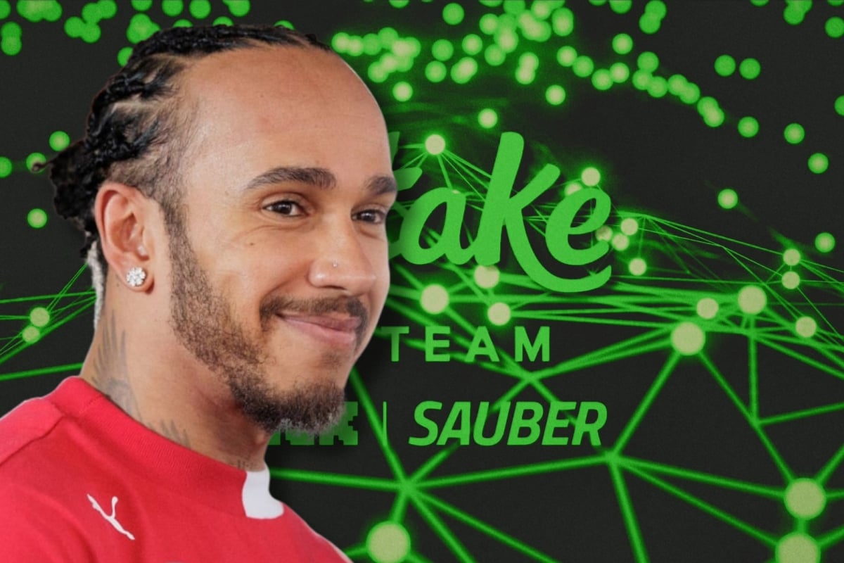 Lewis Hamilton is pictured in front of a Sauber logo