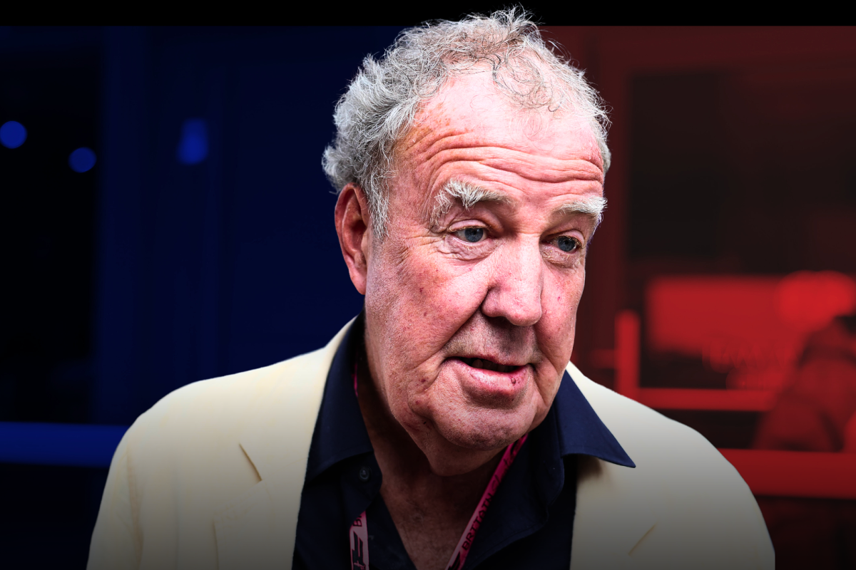 Jeremy Clarkson looking confused with a pink VIP F1 pass round his neck with a blue and red shadow background