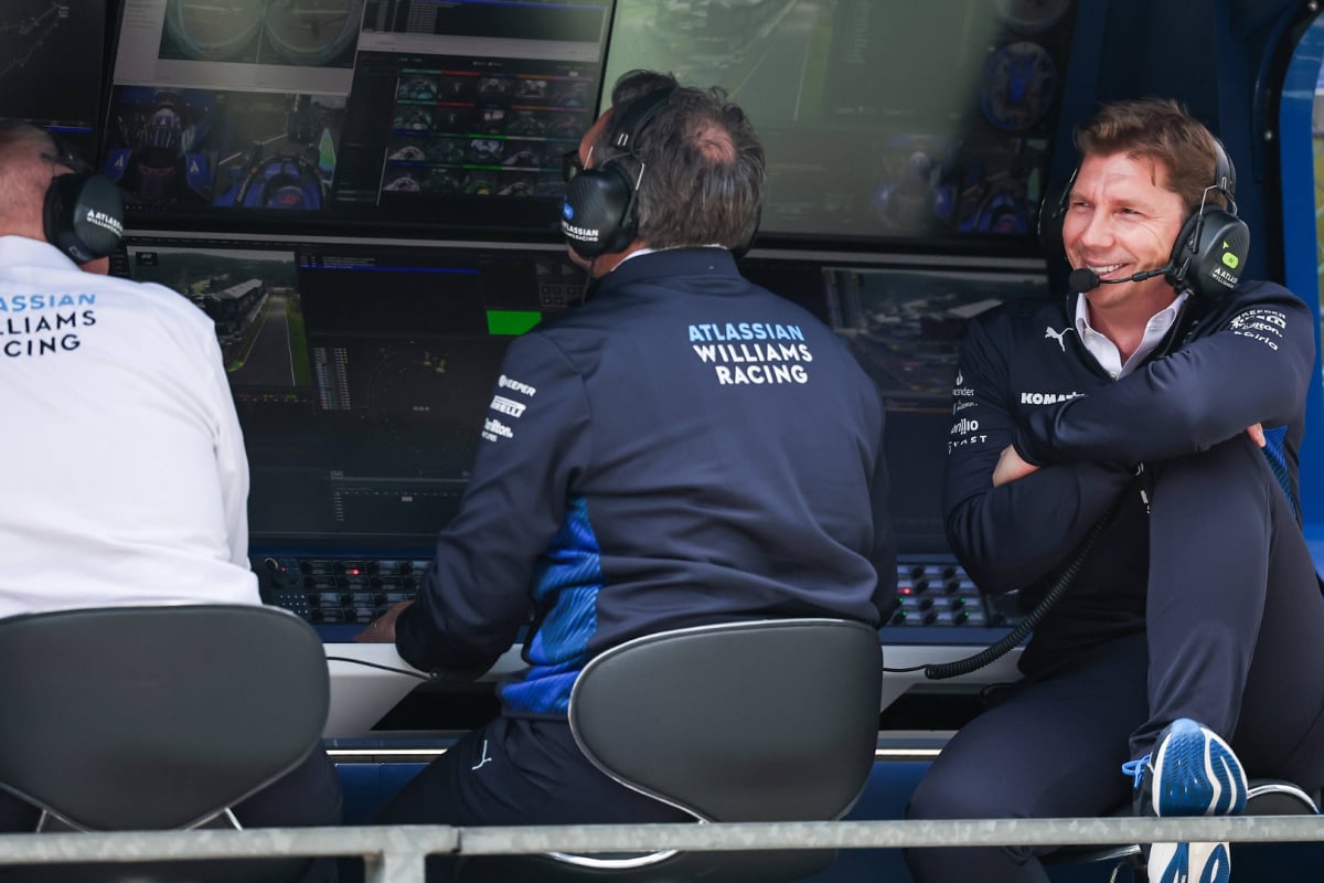 James Vowles smiling sat at the Williams F1 pit wall