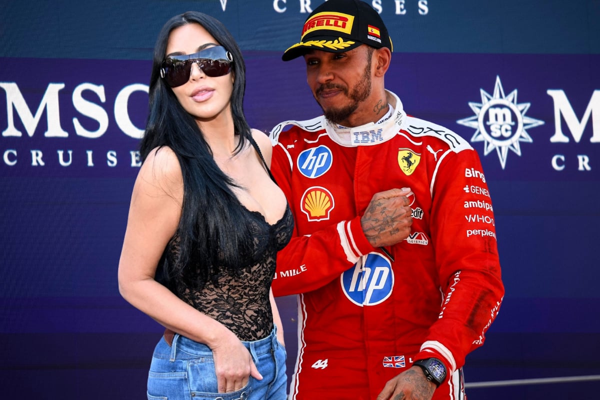kim kardashian edited next to lewis hamilton on the Barcelona podium in ferrari race suit