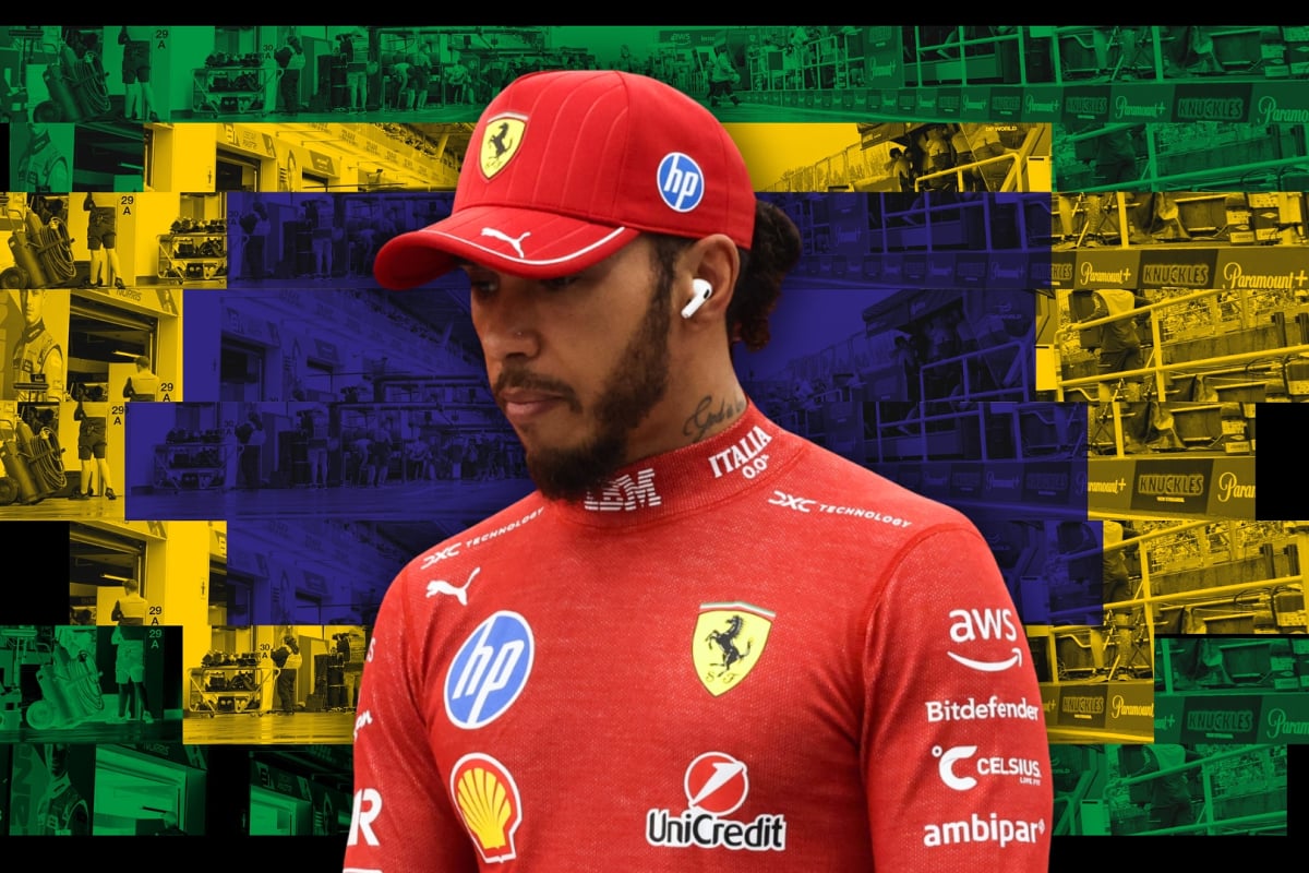 A dejected looking Hamilton in Ferrari race suit and cap in front of a Brazilian-flag themed paddock background