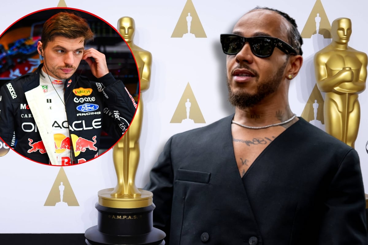 Hamilton in black suit with Oscars-themed awards background featuring circular inset of Verstappen in Red Bull garage in race suit