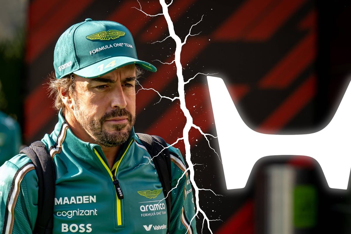 Fernando Alonso and a Honda logo are split by a crack in the picture