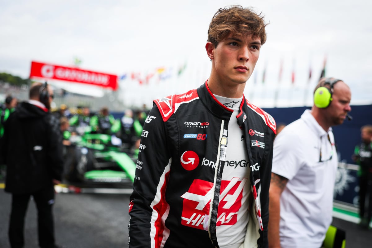 Ollie Berman looks concerned in a Haas race suit