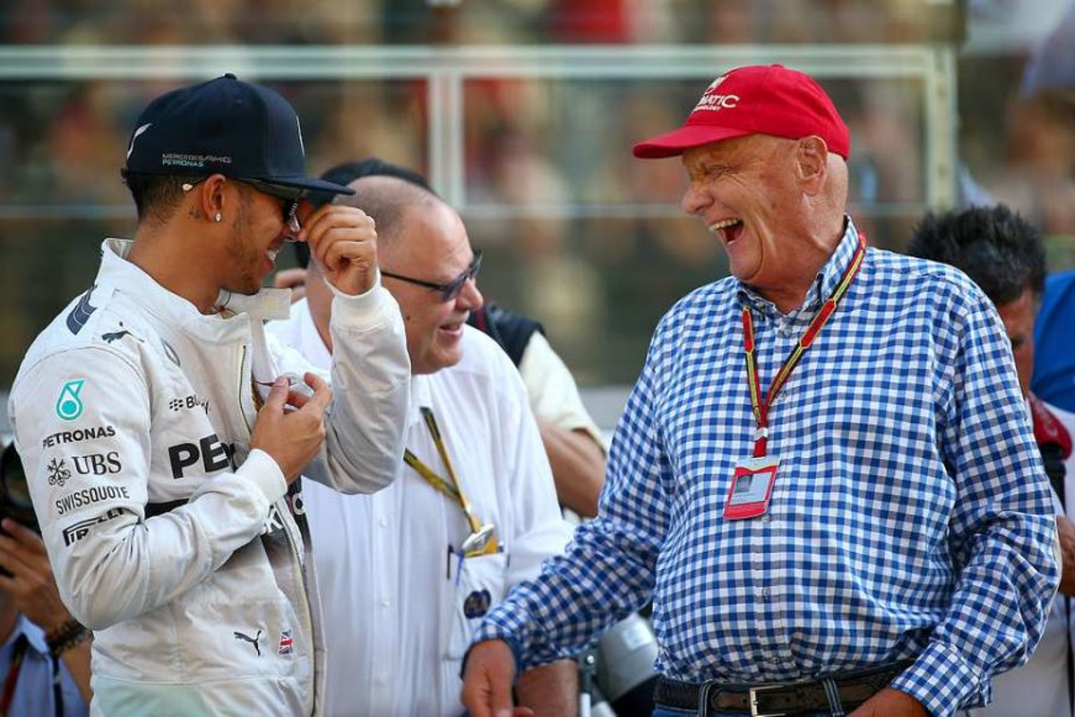 Lewis Hamilton reacts to Lauda passing