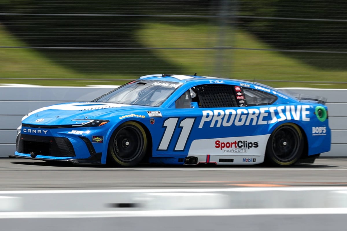 An image of NASCAR's Denny Hamlin driving the No. 11 at Pocono