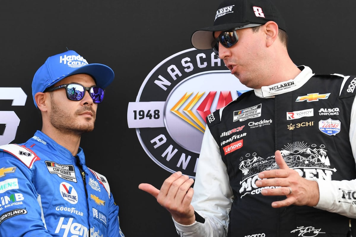 An image of NASCAR champions Kyle Busch and Kyle Larson in conversation