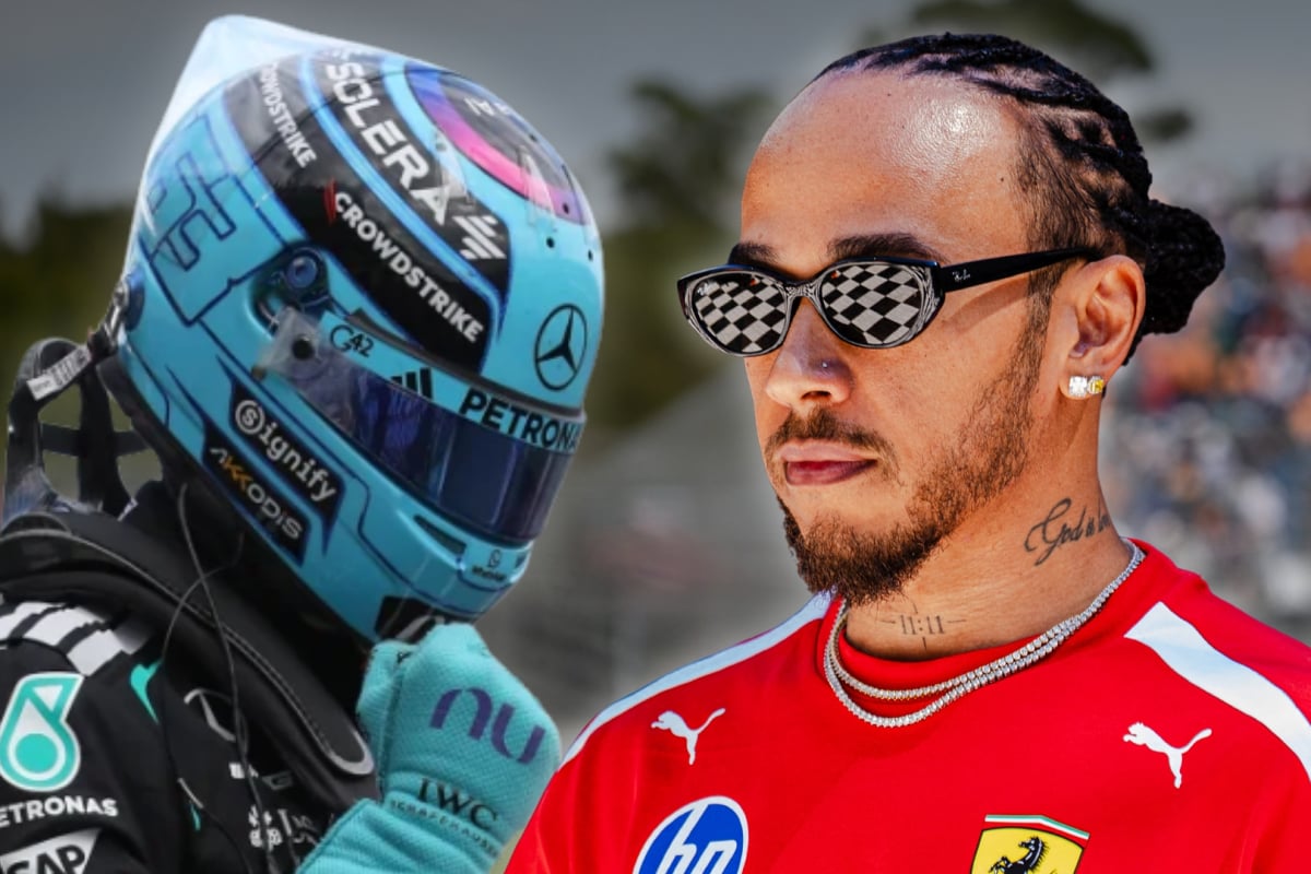Lewis Hamilton looking at a celebrating George Russell with severity