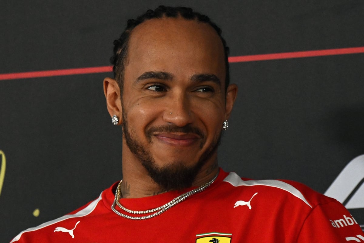 Lewis Hamilton smiling in a press conference at 2026 Bahrain testing