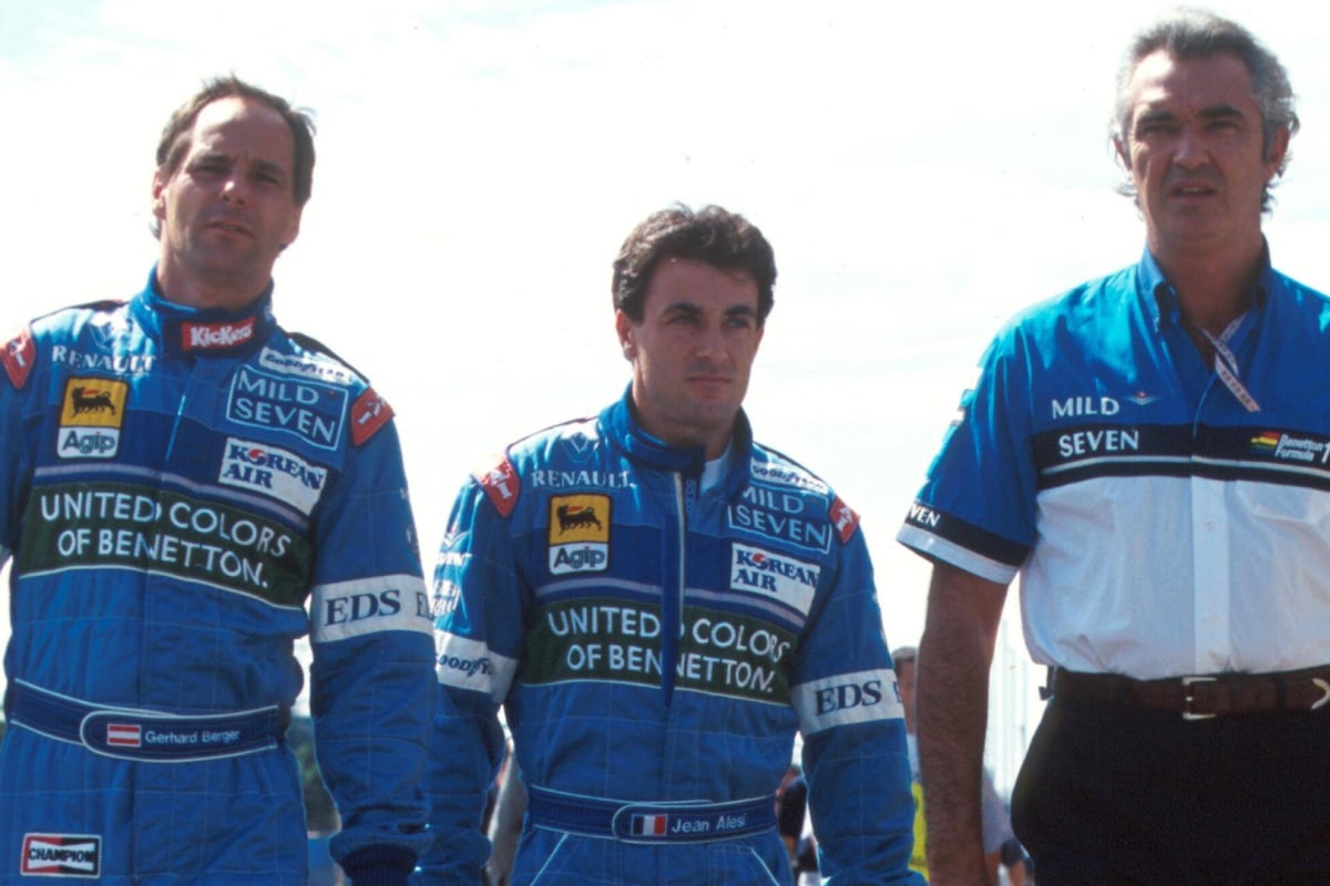 Benetton boss Flavio Briatore walks with Jean Alesi and Gerhard Berger in 1997