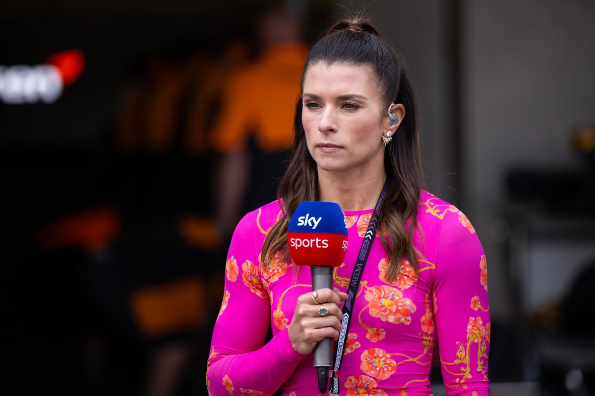 Danica Patrick holds a Sky Sports F1 mic