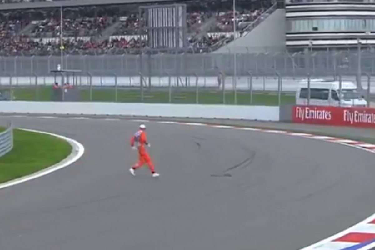 VIDEO: Crazy Russian marshal darts across the track!