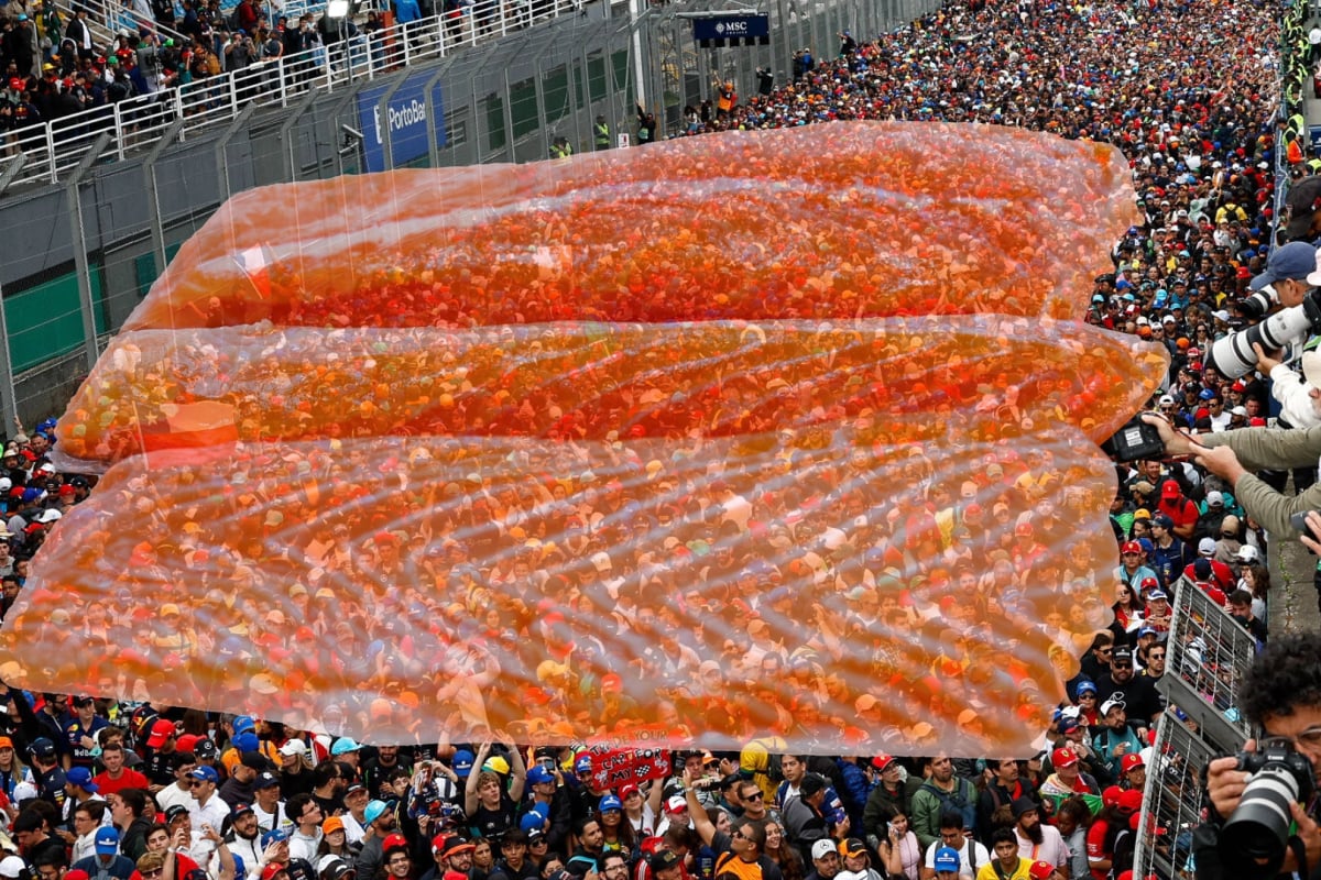 A salmon fillet hovers over F1 fans