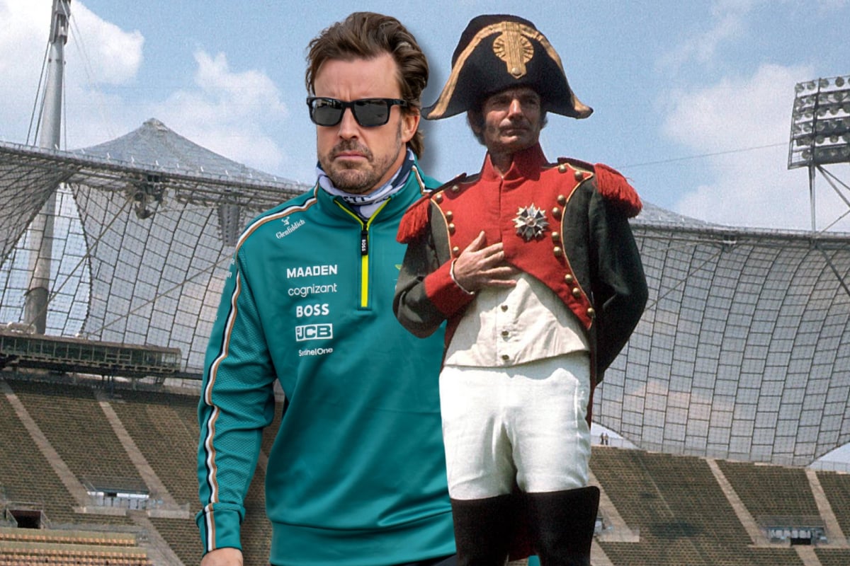Fernando Alonso stands next to Napoleon