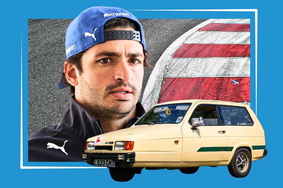 Carlos Sainz looks down on a Reliant Robin