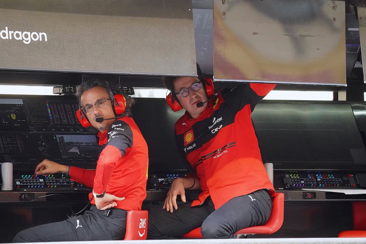 Mekies and Binotto sat on the Ferrari pitwall in Ferrari F1 kit