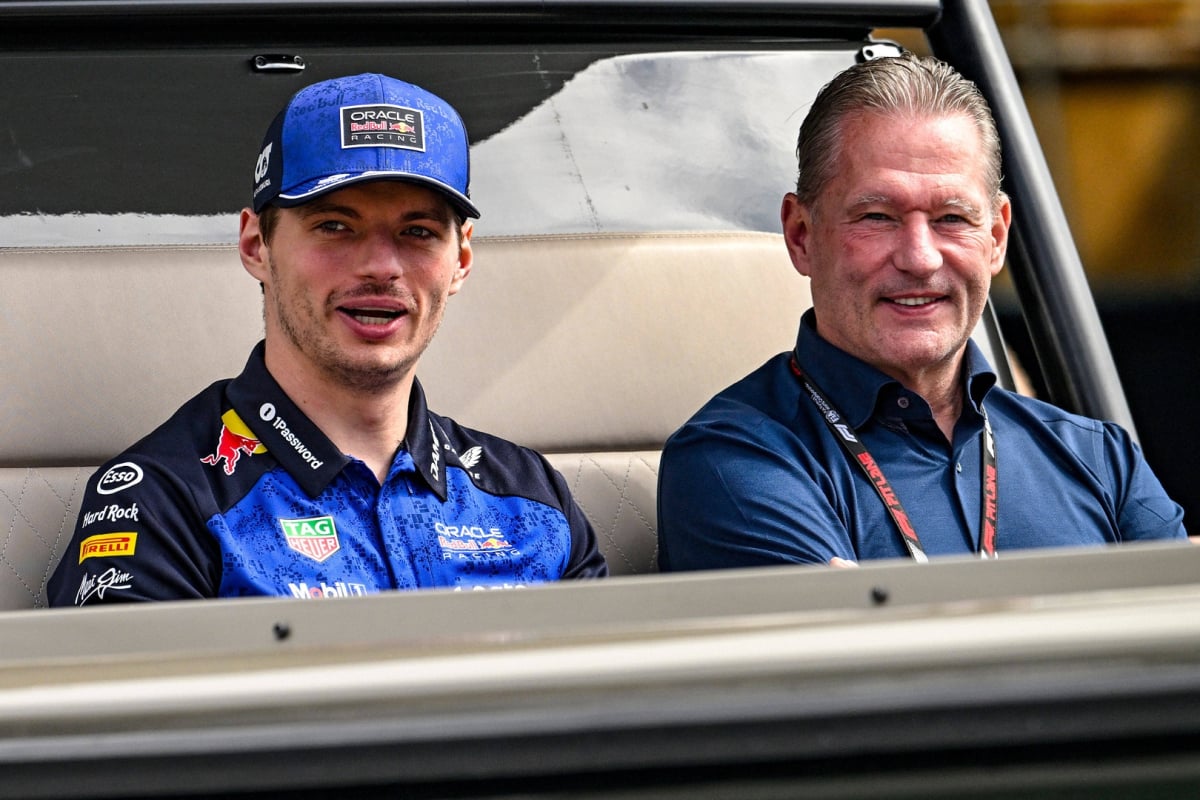 Max and Jos Verstappen sat in a boat together smiling after Max's retirement from Monaco GP