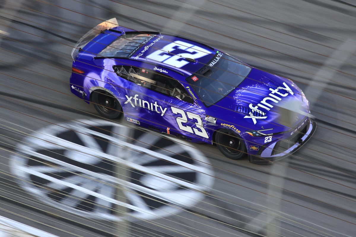An image of 23XI Racing star Bubba Wallace crossing the finish line at Atlanta Motor Speedway