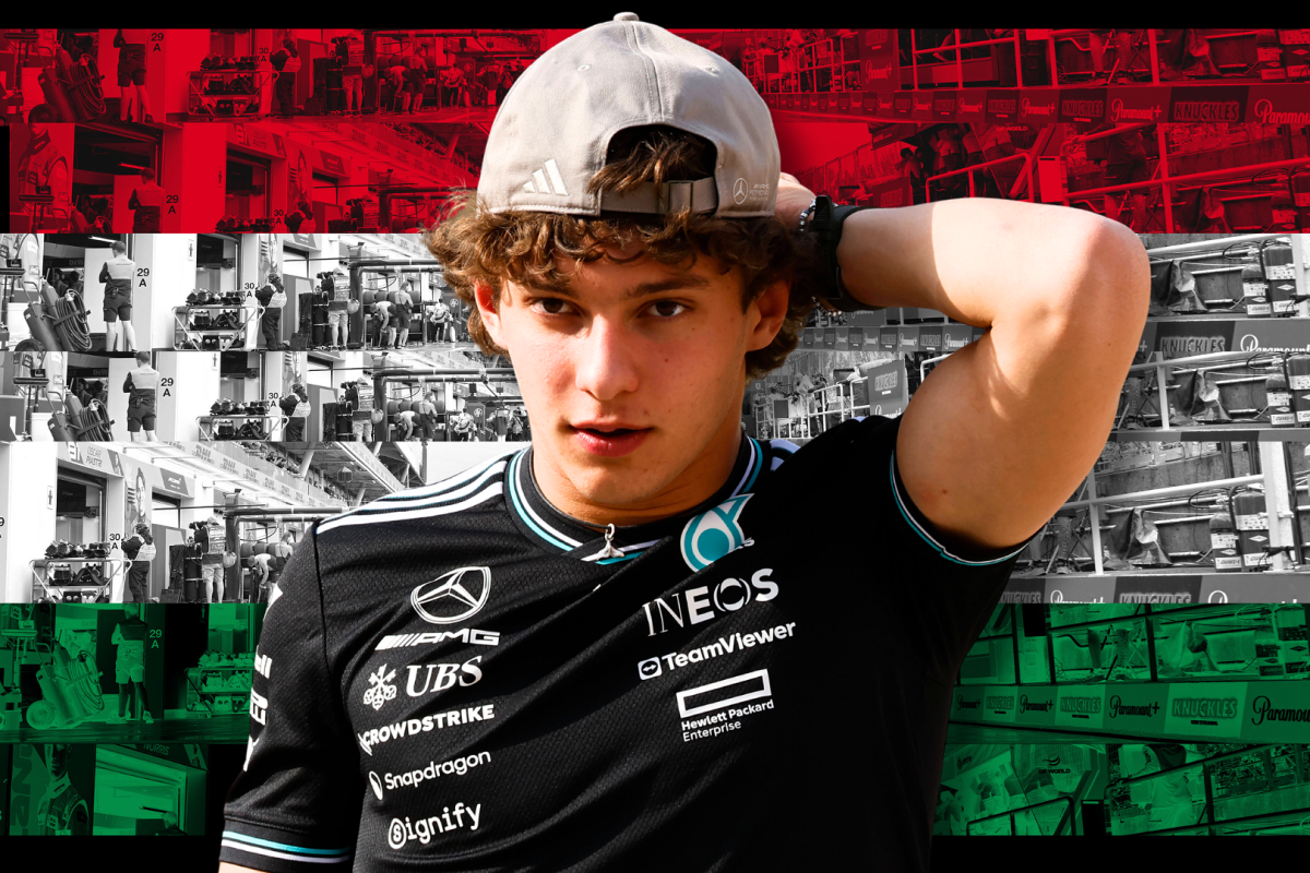 Antonelli with hand on his head wearing a light grey hat and black Mercedes tee with red, white and green Hungarian flag background
