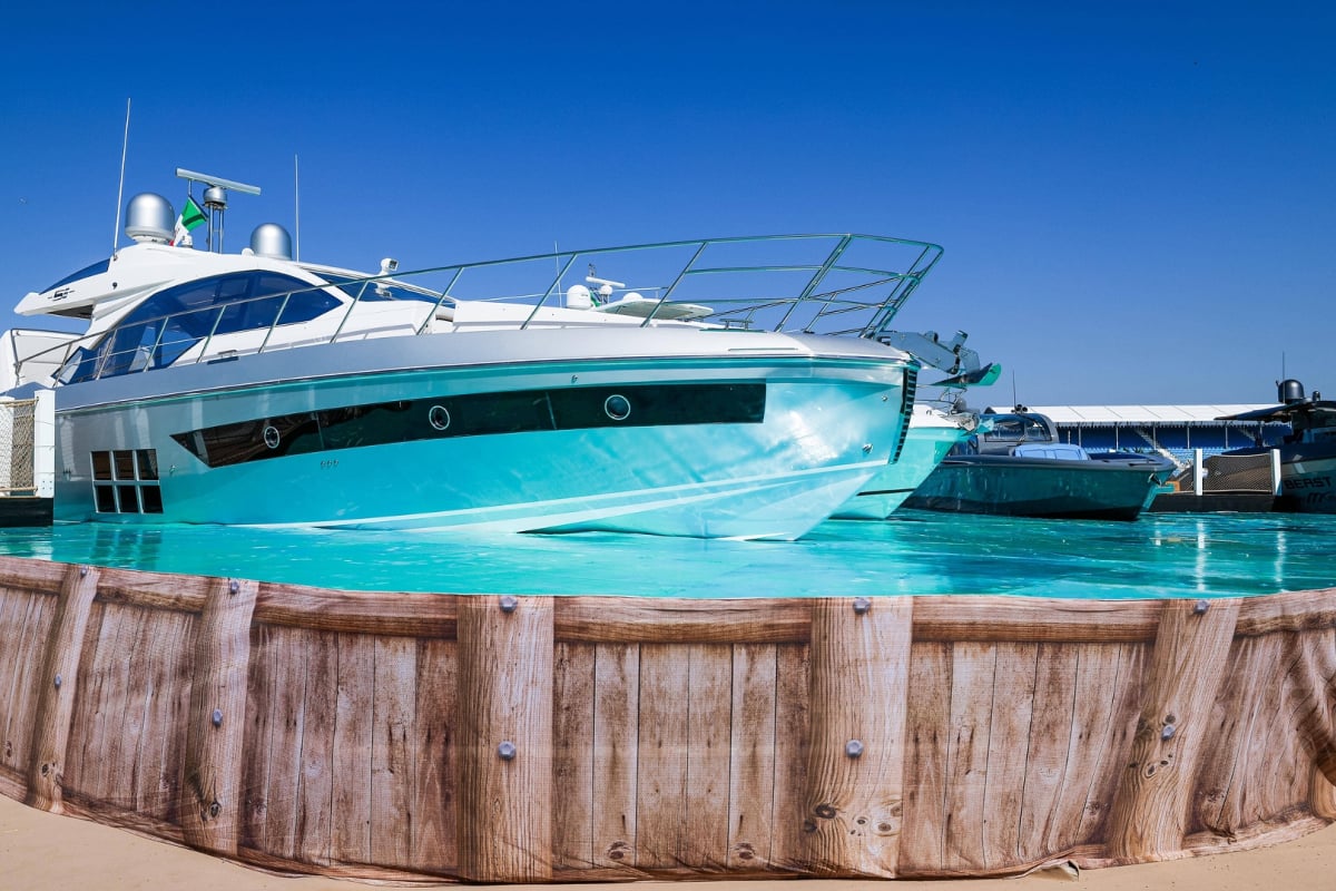 The fake marina at F1's Miami GP in 2022, shot from below 'pool' level with a boat on the vinyl and fake wooden sides