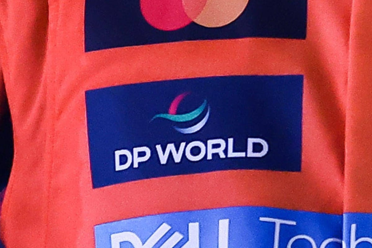 The DP World logo is seen on the McLaren racesuit