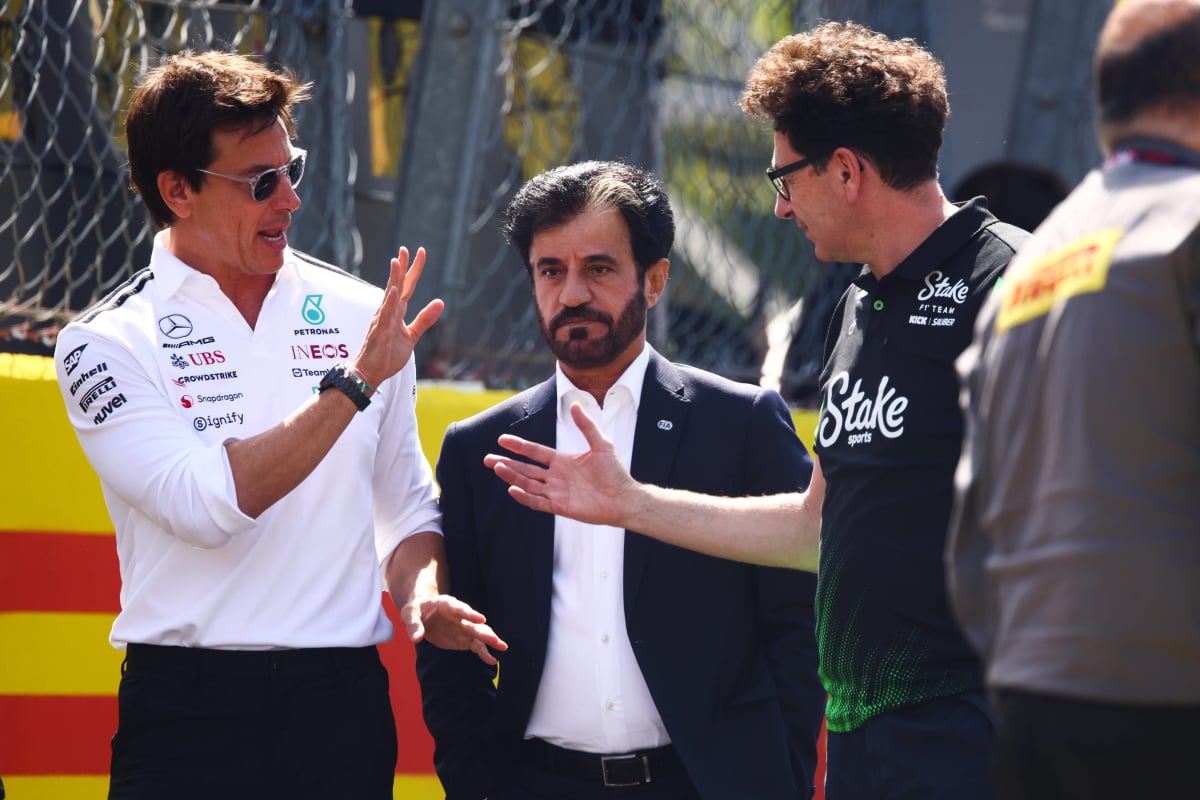 Toto Wolff, Mattia Binott, Mohammed Ben Sulayem in conversation walking down the paddock