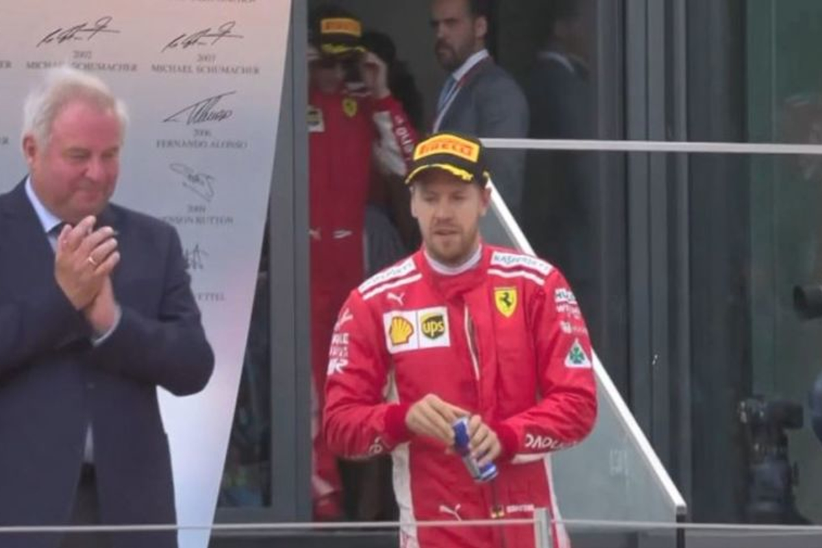 AWKWARD: Vettel grabs a Red Bull after finishing behind Verstappen