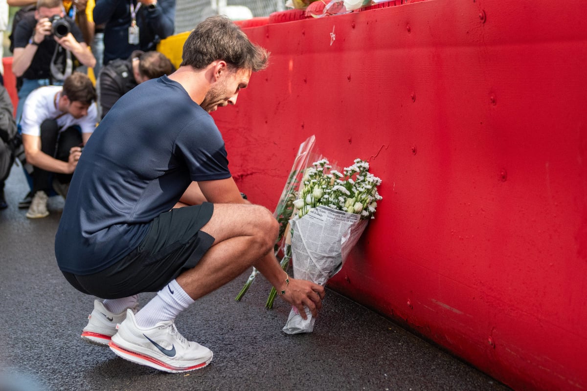Pierre Gasly lays flowers for Anthoine Hubert at Spa