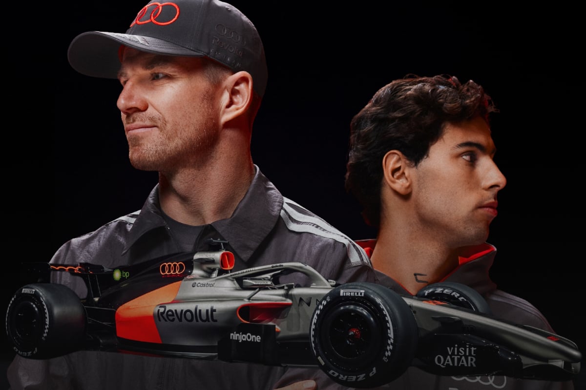 Gabriel Bortoleto and Nico Hulkenberg above the new Audi F1 car - Photo Credit Audi