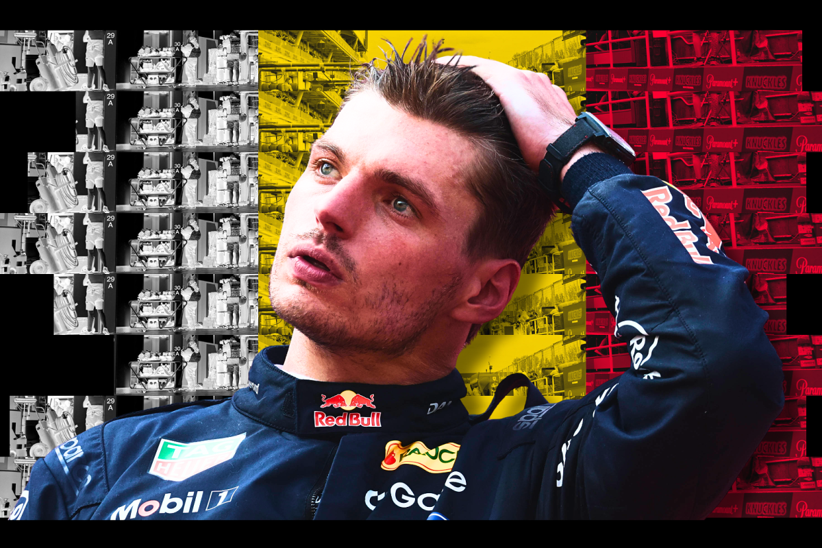 Verstappen in Red Bull race suit running hand through hair with black, yellow and red Belgian flag background