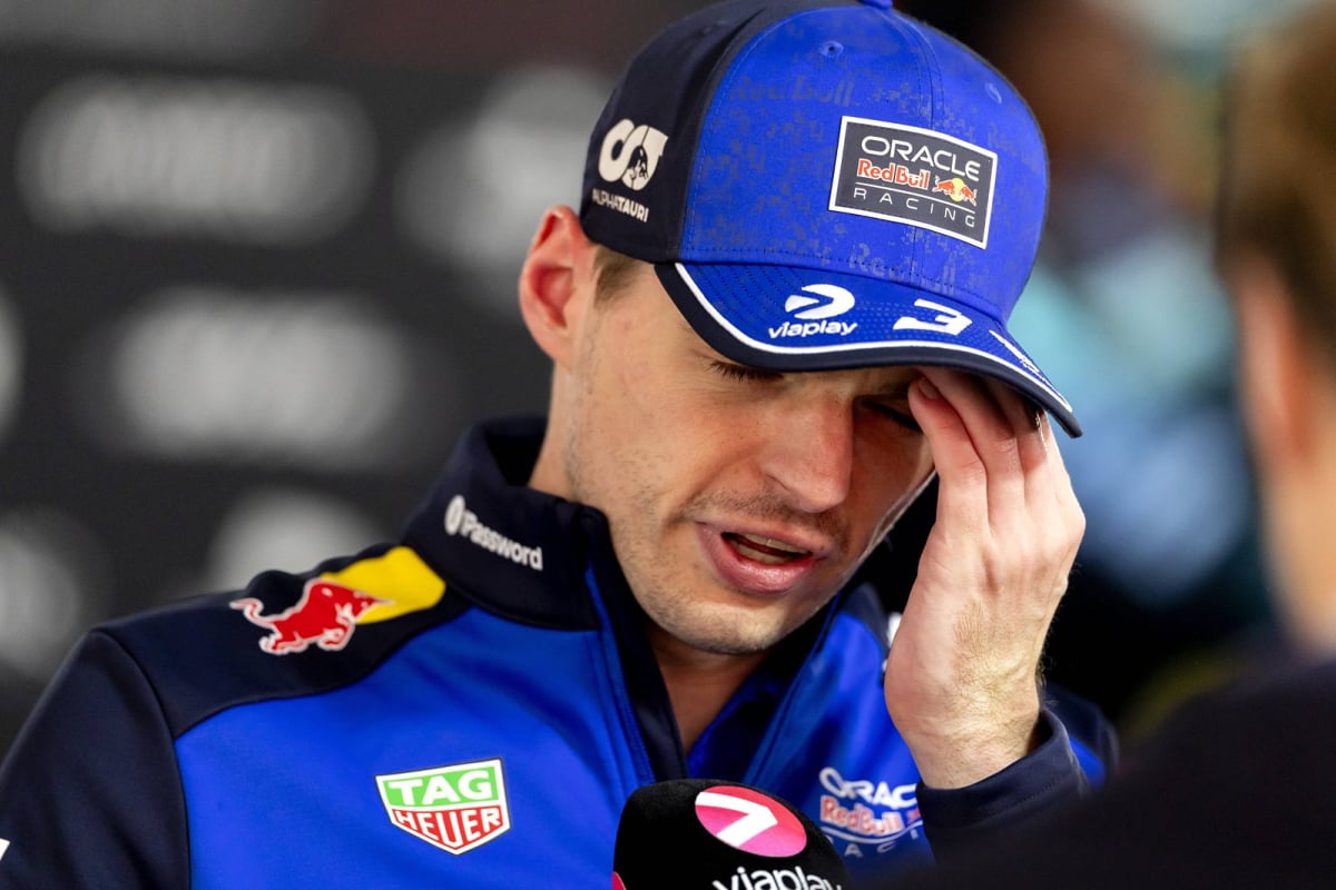 Max Verstappen raises his palm to his forehead