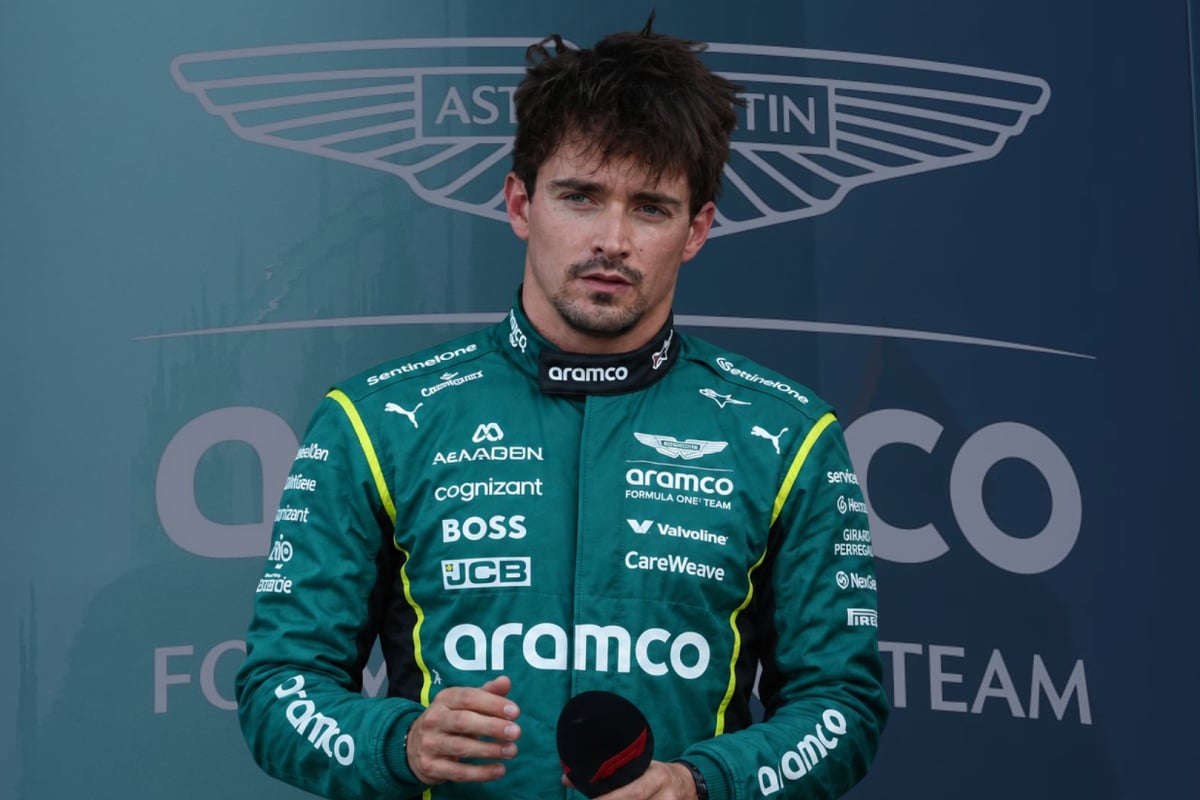 Charles Leclerc is mocked up wearing an Aston Martin race suit