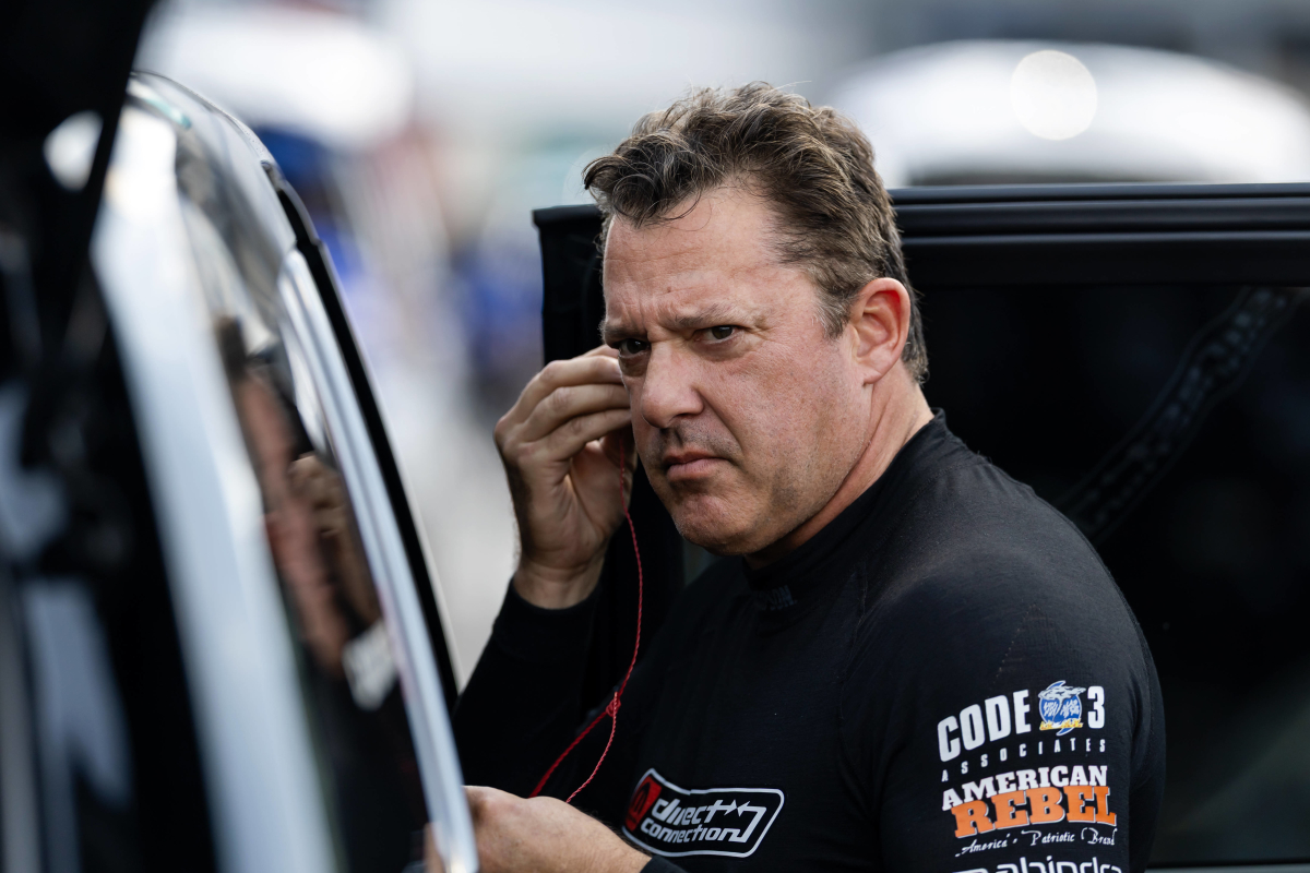 An image of three-time NASCAR Cup champion Tony Stewart preparing for a race