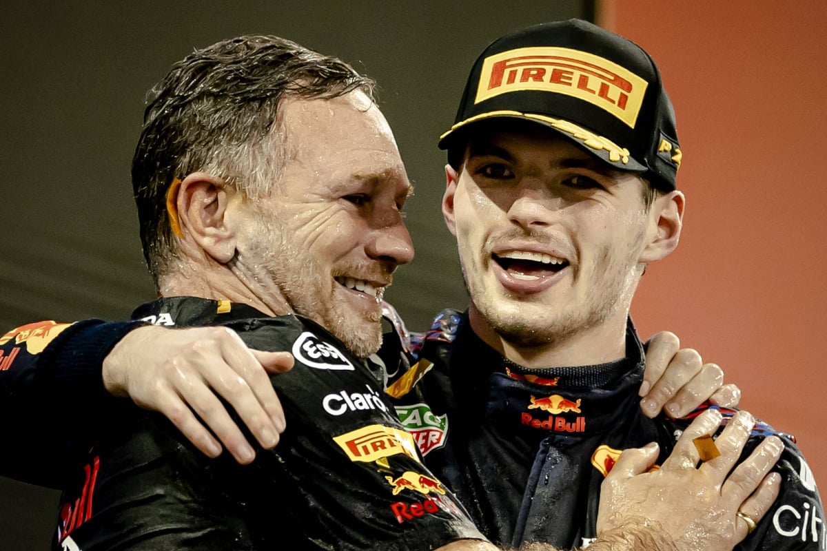Christian Horner and Max Verstappen hug after winning the 2021 F1 drivers' title