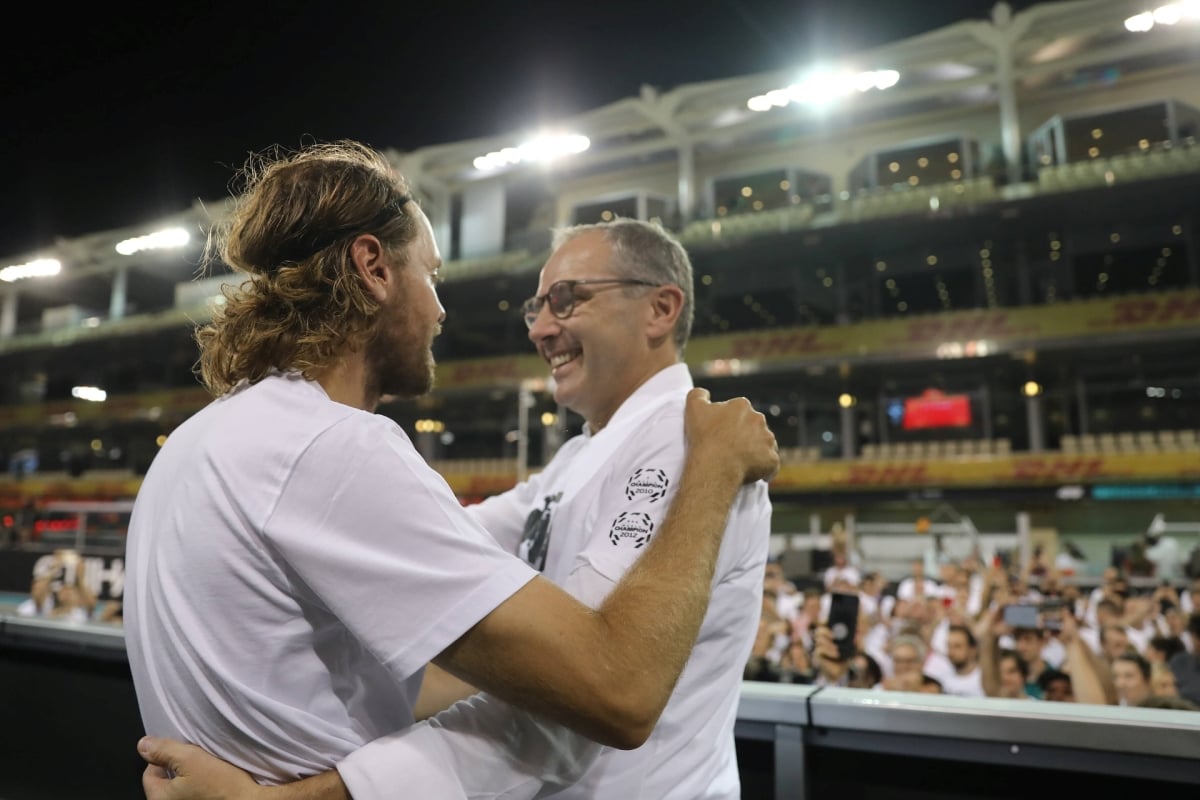 Stefano Domenicali embracing Sebastian Vettel at the 2022 Abu Dhabi Grand Prix following Vettel's last F1 race