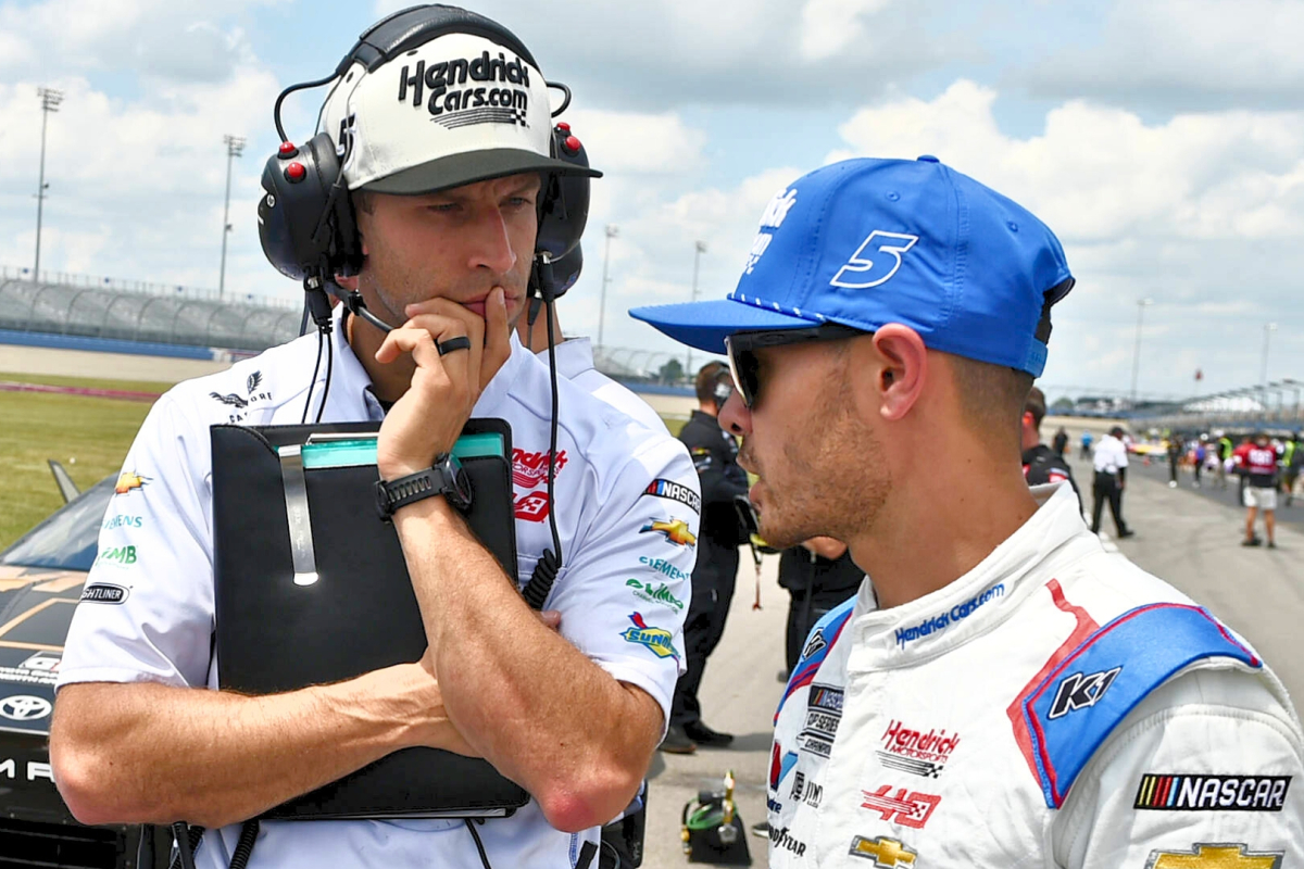 An image of NASCAR driver Kyle Larson and crew chief Cliff Daniels discussing strategy before a race