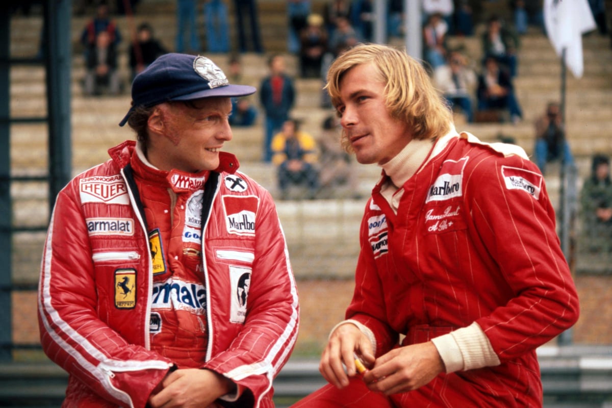 Niki Lauda chats with James Hunt at a race in 1977